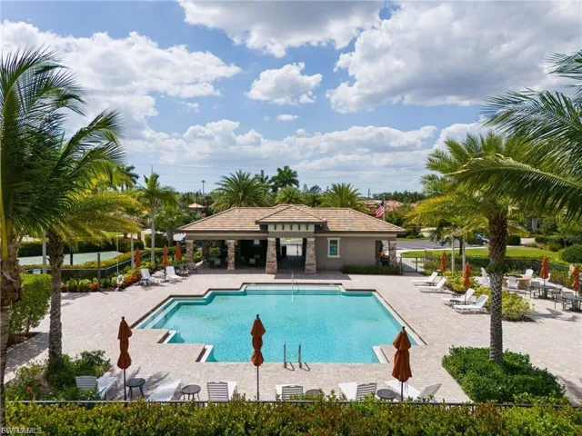 Community pool featuring a patio