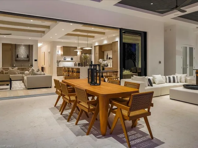 Dining space featuring a tray ceiling and recessed lighting