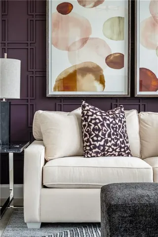 Living area featuring a decorative wall