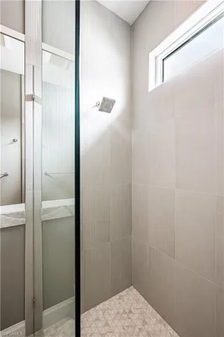 Full bath with a tile shower