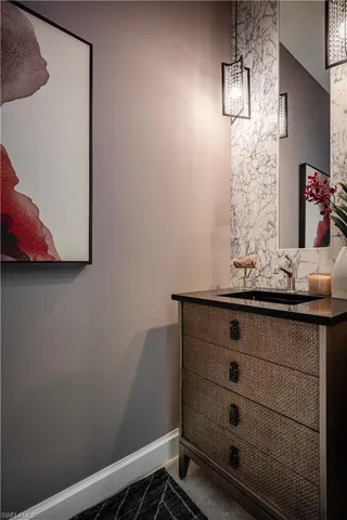 Foyer featuring a chandelier, beam ceiling, and light tile patterned flooring