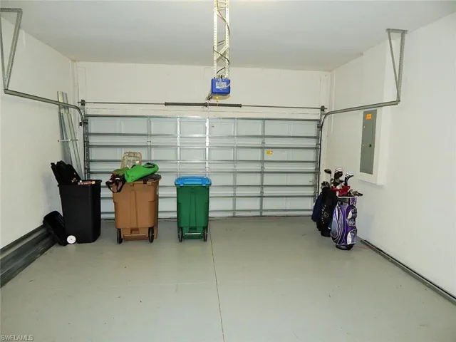 Garage with a garage door opener and electric panel