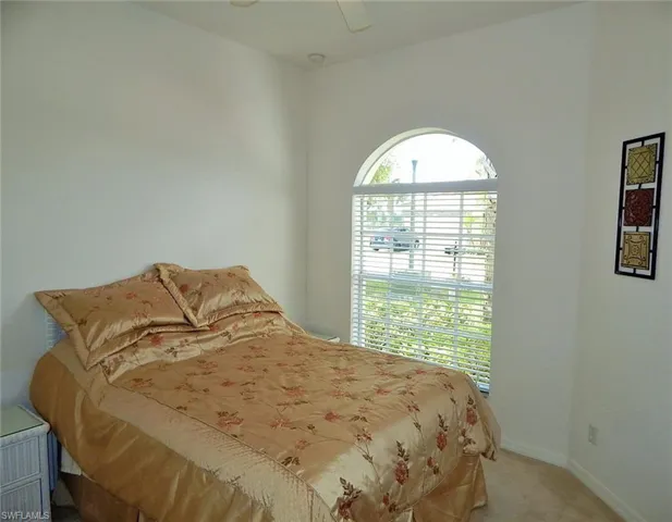 Bedroom featuring carpet flooring and a ceiling fan