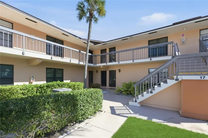 View of apartment building / complex with stairs