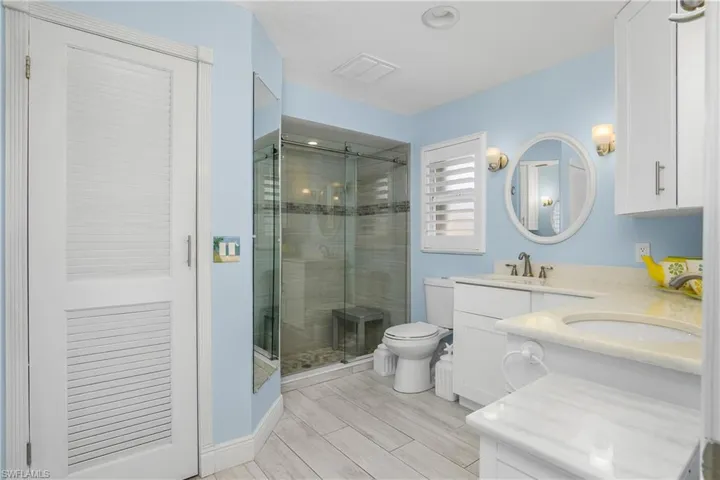 Primary Bath with dual sinks and seamless walk in shower
