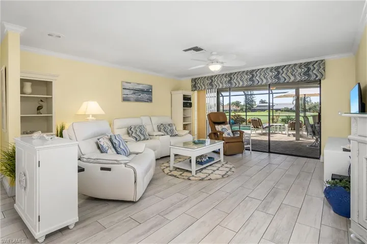 Living room with Sliders to Lanai and Pool