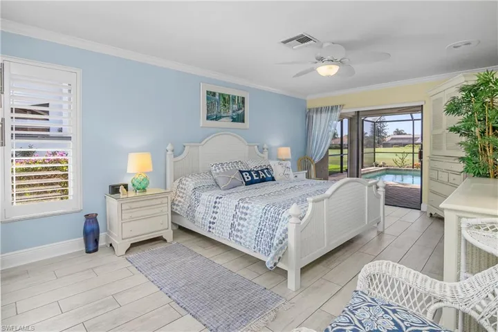 Primary bedroom with Golf course and Lake views.