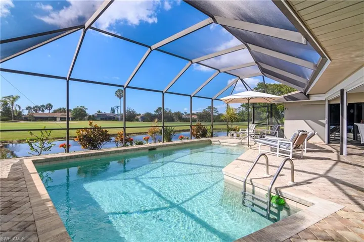 Heated pool with lake and golf views