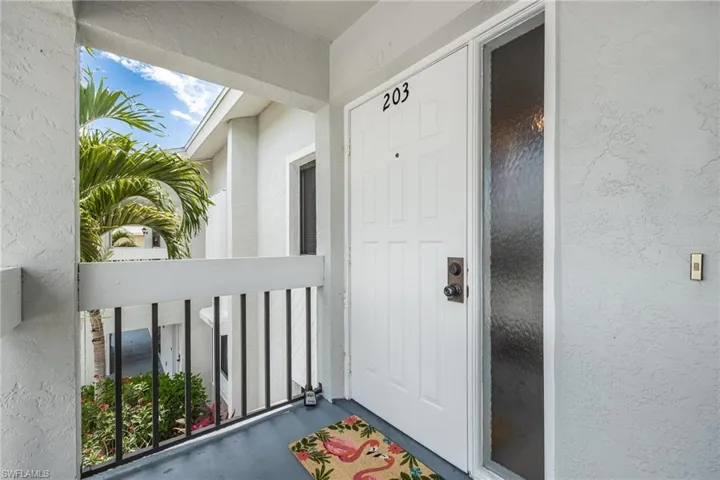 View of exterior entry featuring stucco siding
