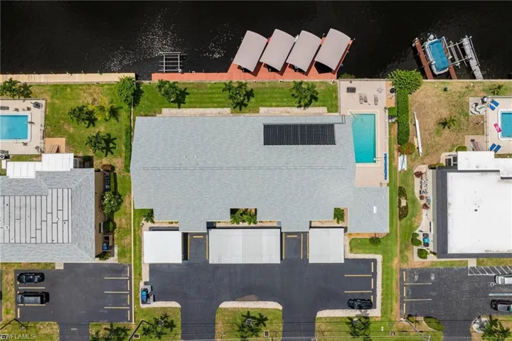 Bird's eye view of a pool and a large body of water