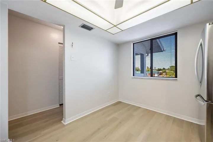 Spare room featuring light wood-style flooring and ceiling fan