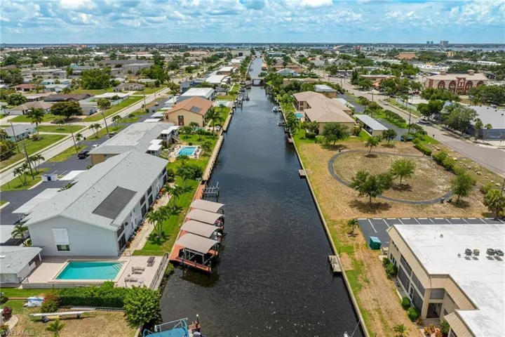 Aerial perspective of suburban area featuring a large body of water
