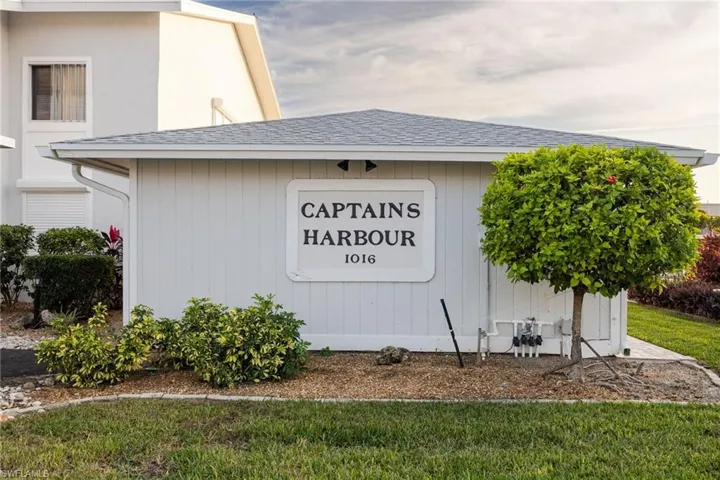 Community sign with a lawn