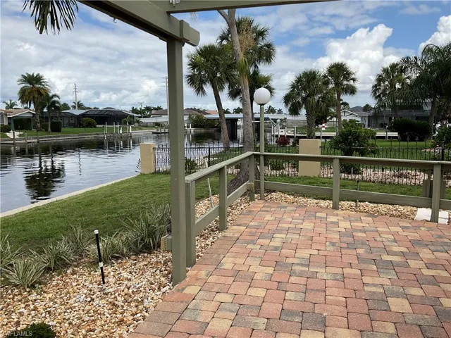 View of patio / terrace featuring a water view and a dock