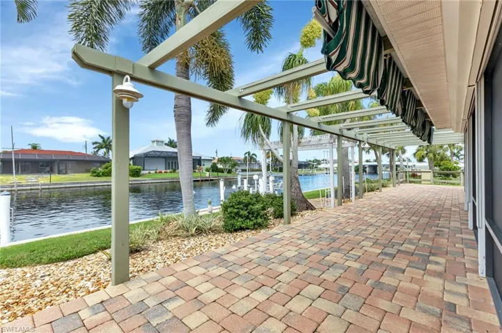 View of patio with a water view
