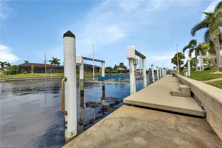 Dock area featuring a water view