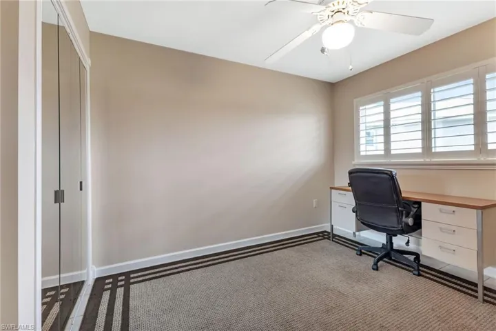 Tiiled bedroom with area rug