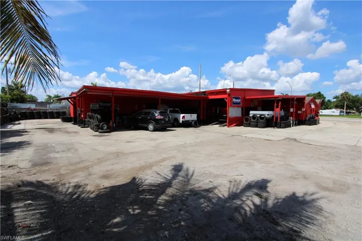 View of vehicle parking featuring a carport