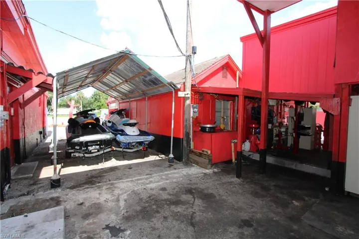 View of parking with a carport