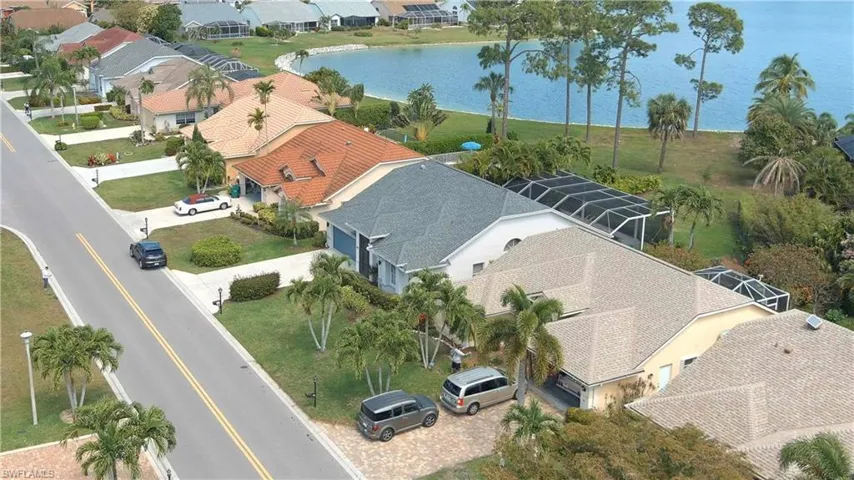 Aerial perspective of suburban area with a large body of water