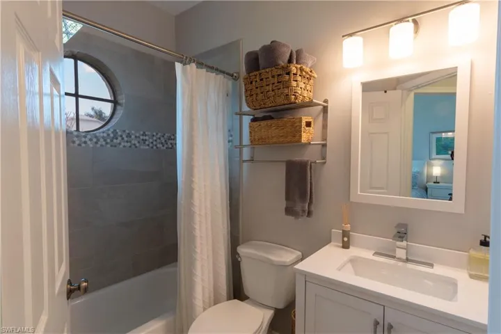 Full bathroom with vanity and shower / tub combo