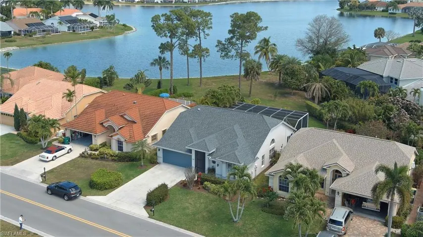 Aerial view of residential area with a large body of water
