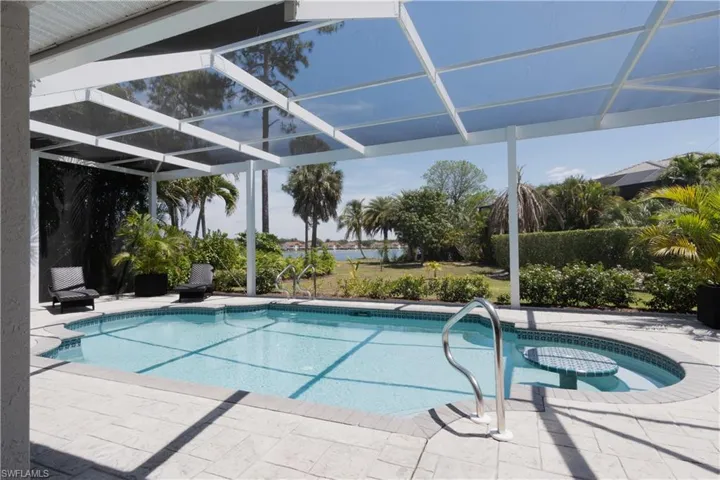 Outdoor pool with a patio area, a lanai, and a sunroom