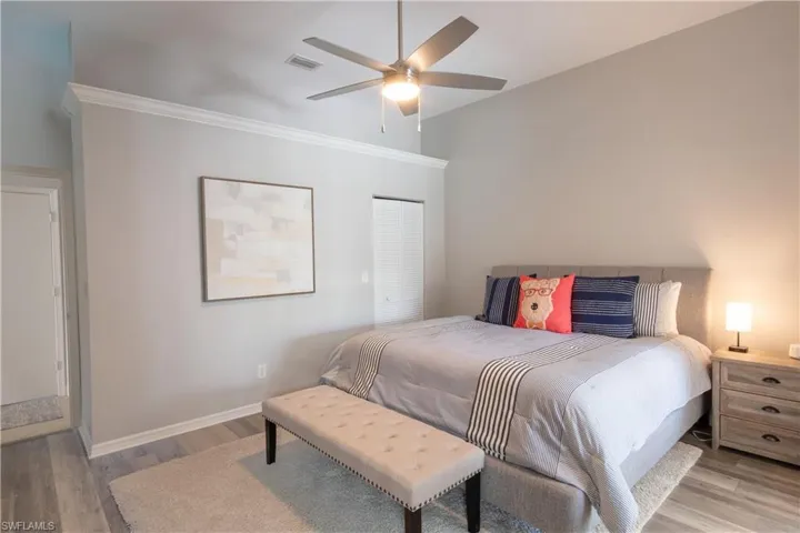 Bedroom with light wood-style flooring and ceiling fan