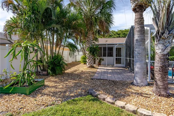 View of yard with a sunroom