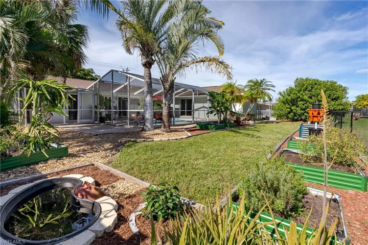 View of yard featuring glass enclosure