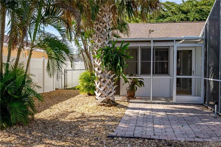 View of yard with a patio area and a sunroom