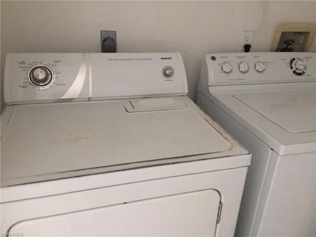 Laundry area with washing machine and clothes dryer
