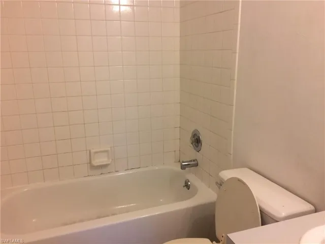 Bathroom with vanity and  shower combination