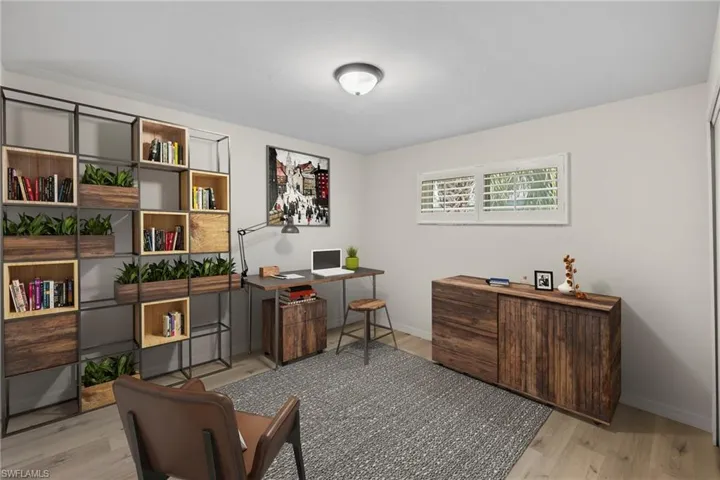 Office space with wood finished floors and baseboards
