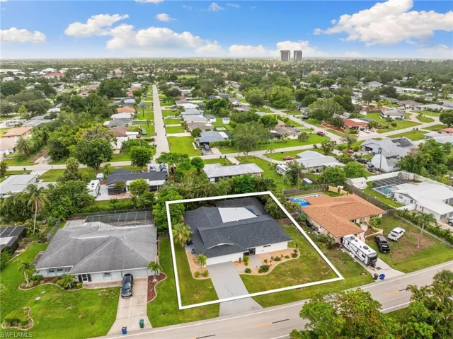 Aerial perspective of suburban area with property boundaries highlighted