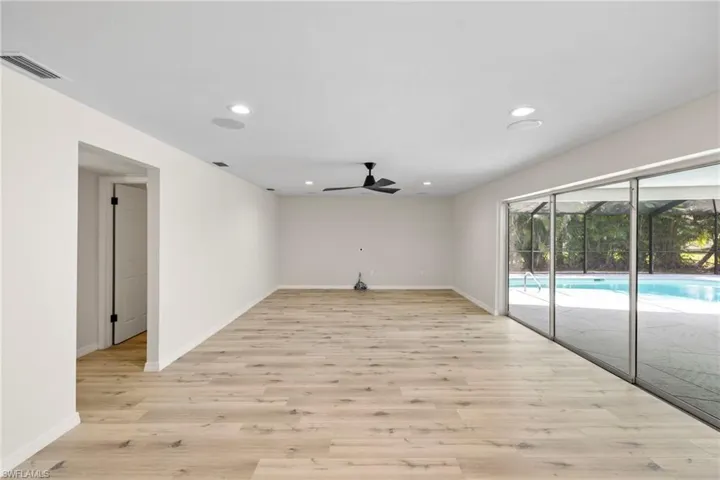 Unfurnished room with light wood-type flooring, recessed lighting, and ceiling fan
