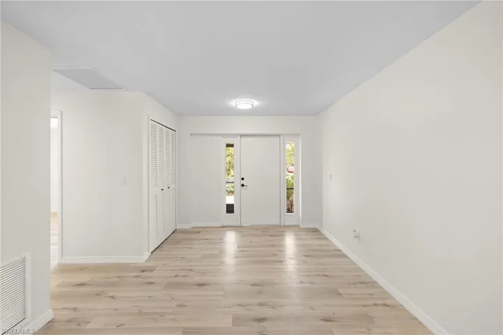 Entryway featuring light wood finished floors and baseboards