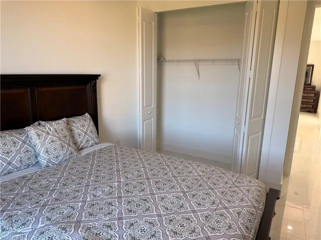 Bedroom with a closet and baseboards