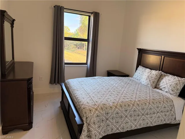 Bedroom featuring baseboards