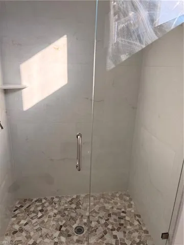 Bathroom featuring a shower stall