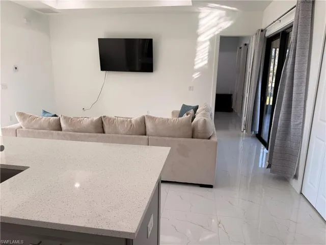 Living area featuring light marble finish flooring