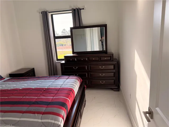 Bedroom featuring baseboards