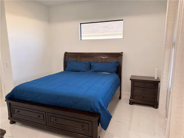 Bedroom featuring baseboards
