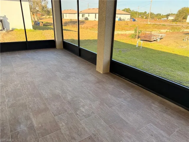 Unfurnished sunroom featuring a residential view