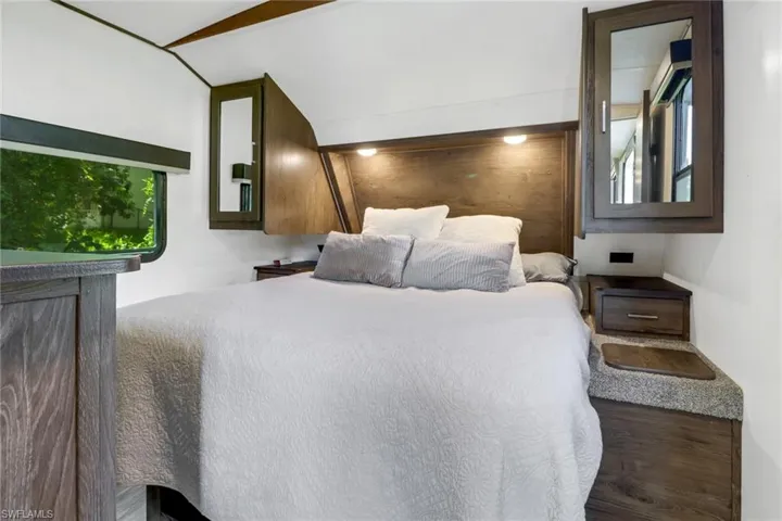 Bedroom featuring dark hardwood / wood-style flooring