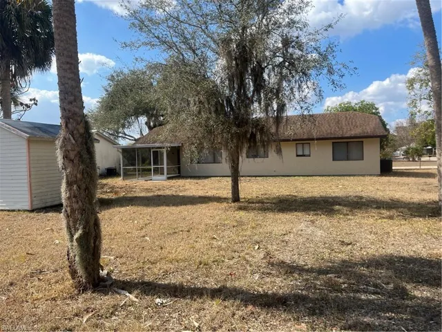 Back of house featuring a sunroom