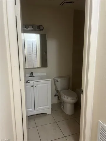 Bathroom featuring vanity and light tile patterned floors