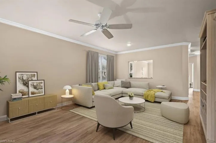 Living room with crown molding, hardwood / wood-style flooring, and ceiling fan