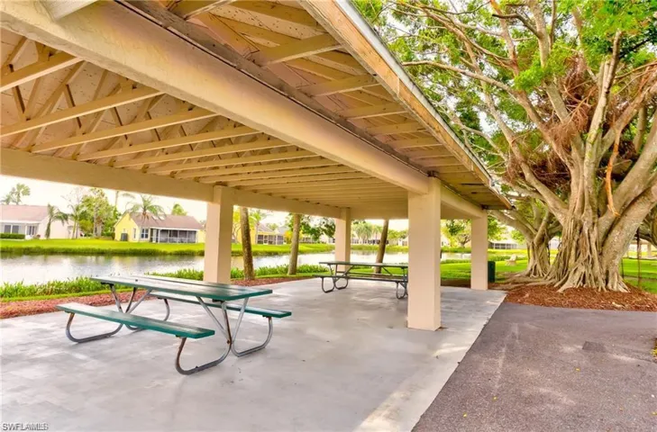 Surrounding community with a gazebo and a water view