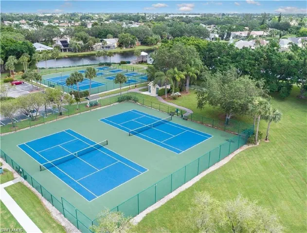 View of sport court featuring a water view